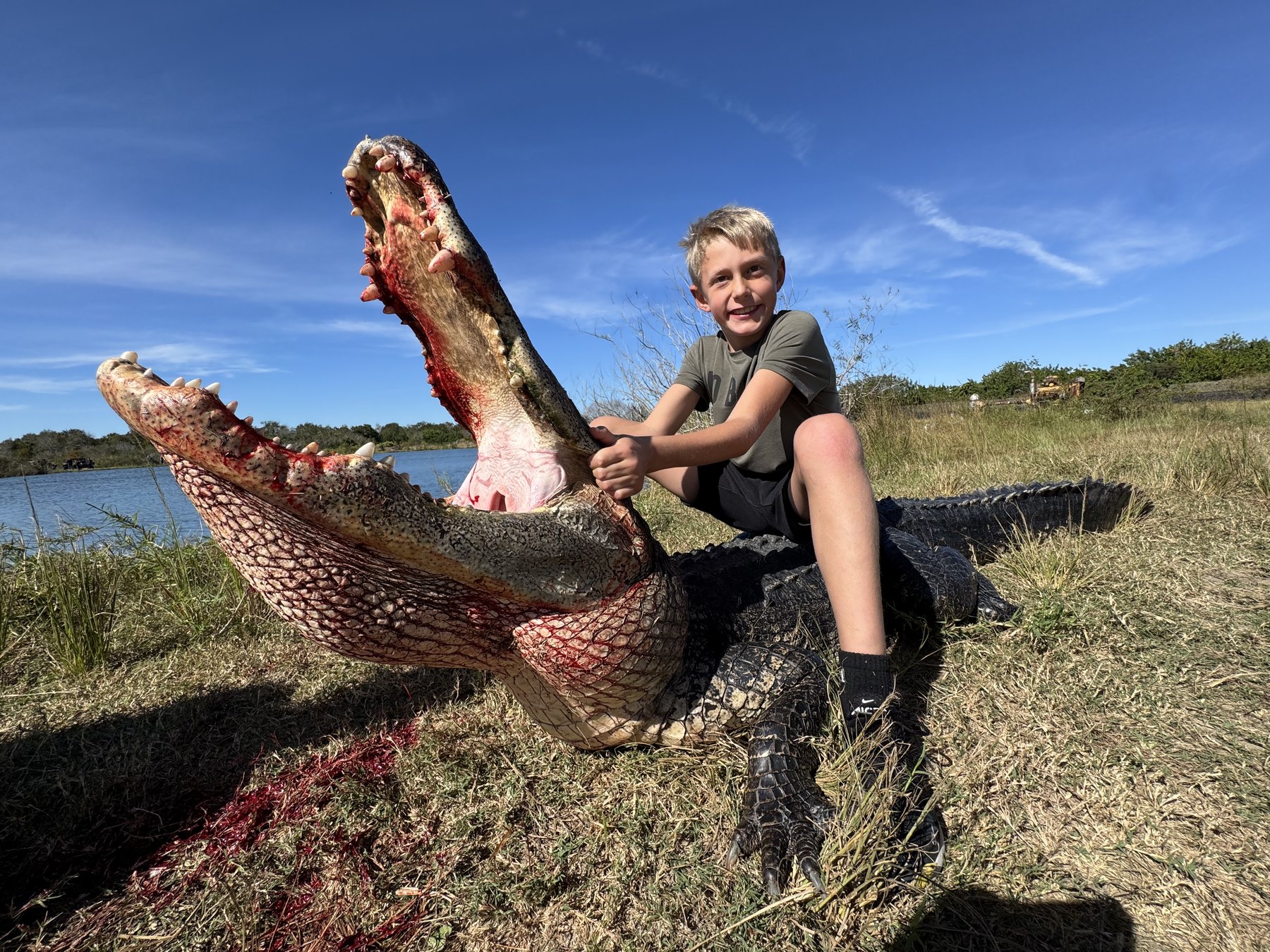 Kid with trophy alligator Wild Florida Hunts