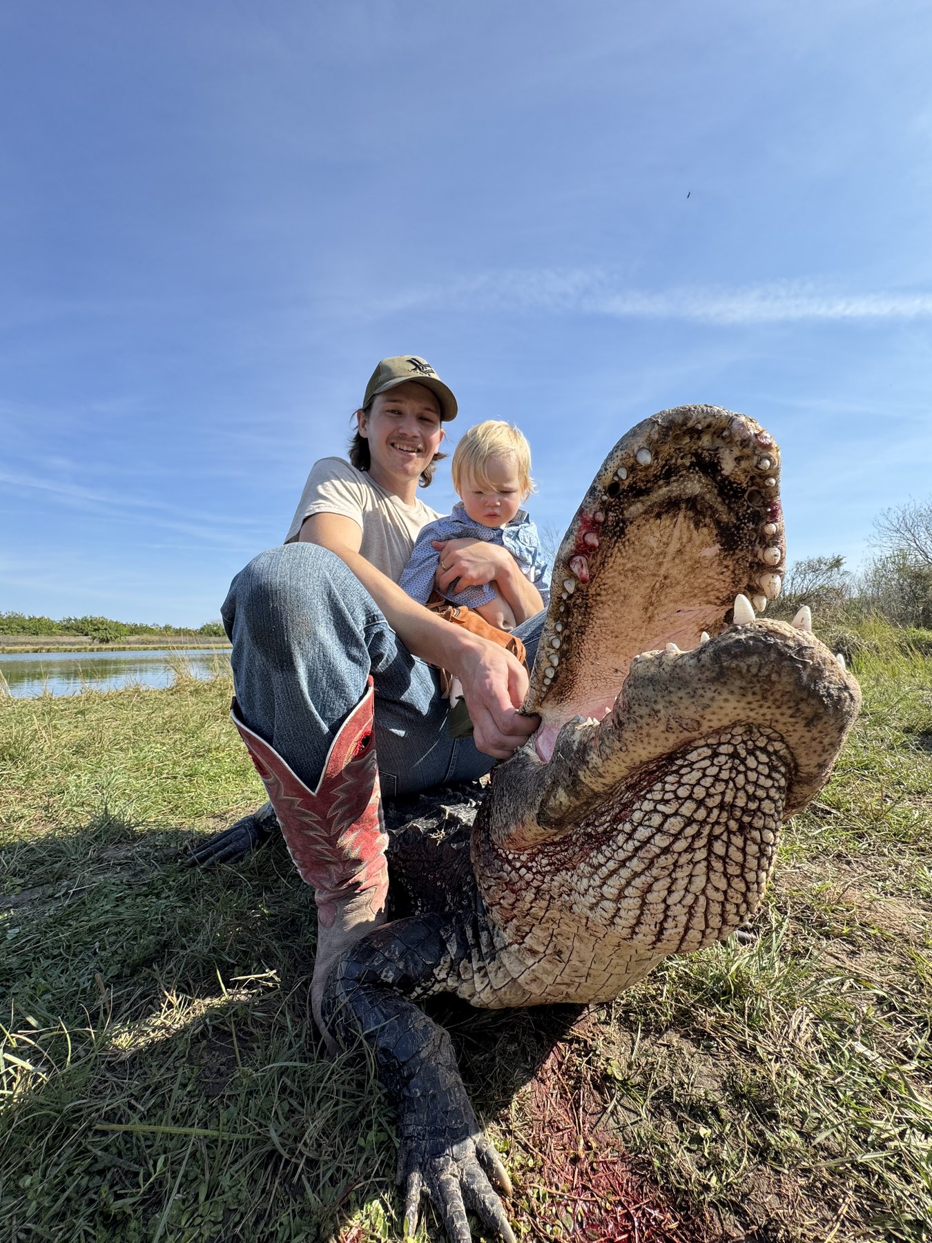 Dad and baby with gator Wild Florida Hunts