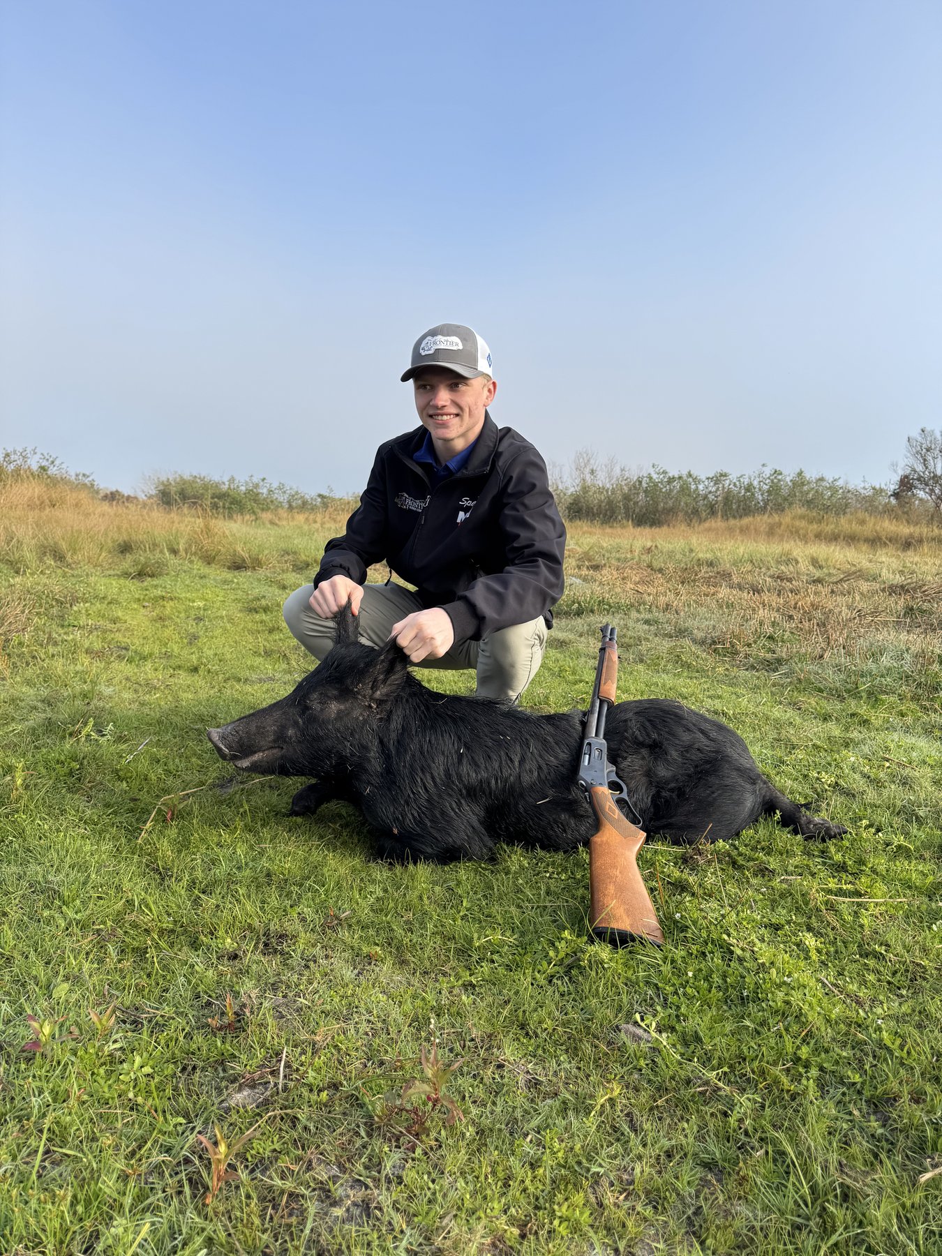 Young hunter with wild hog Florida