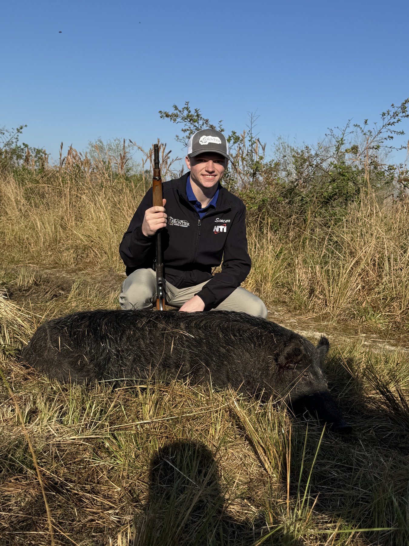 Hunter with trophy hog Wild Florida Hunts